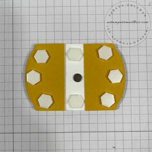 Layering dies for a flip open focal point