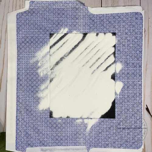 Load the paper with white embossing powder